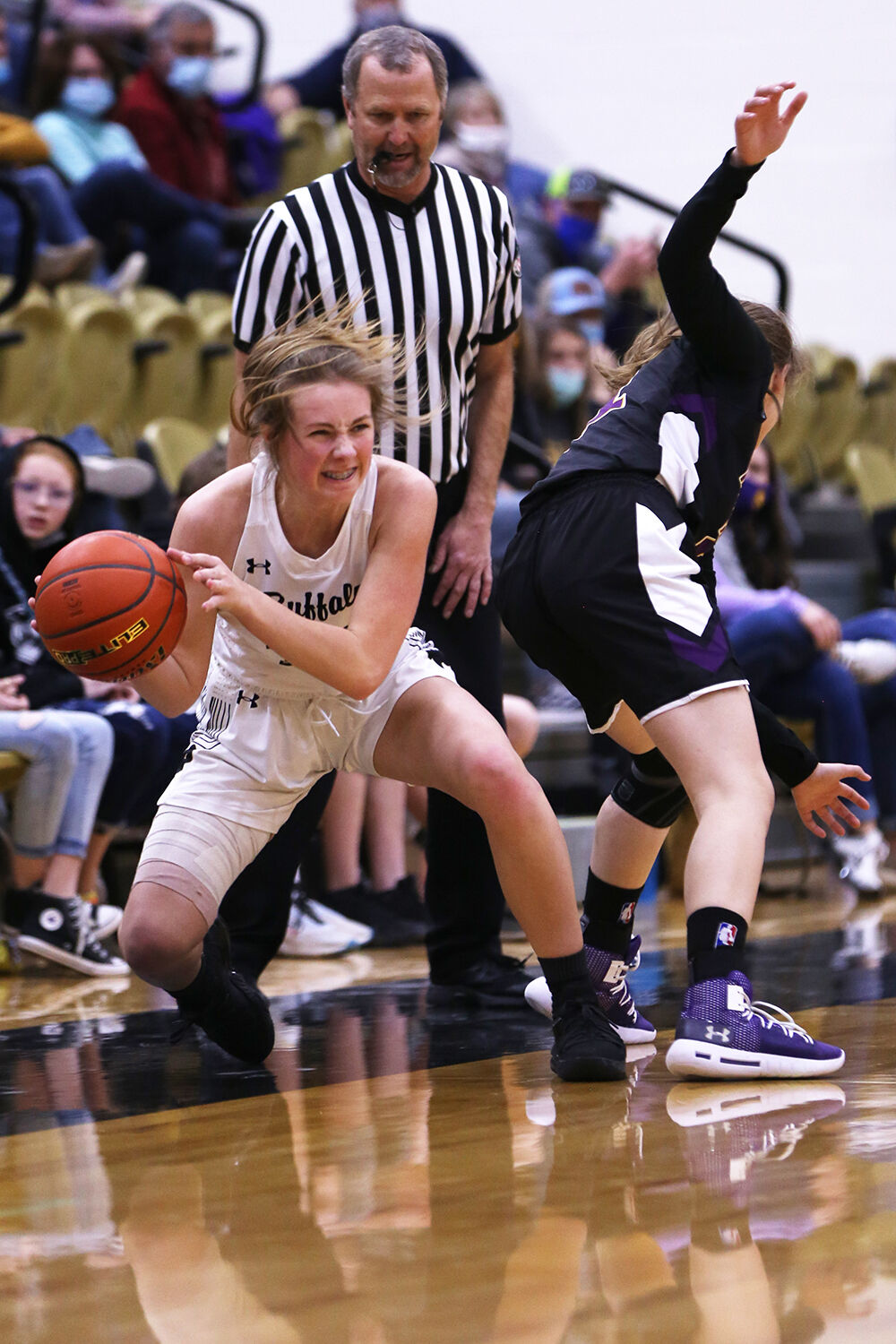 Ava Wagner fights to keep the ball in bounds along the sideline